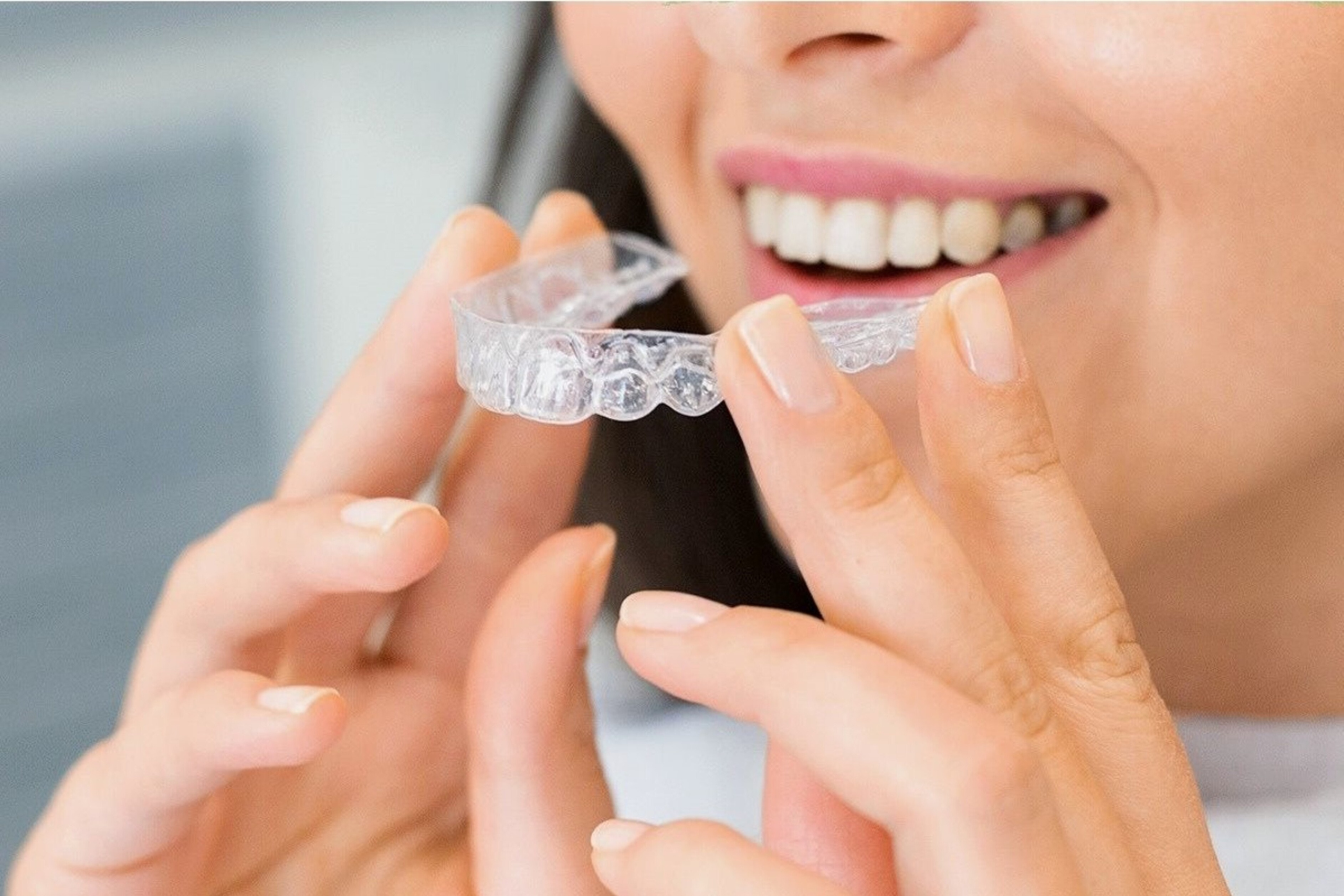 Patient holding Invisalign