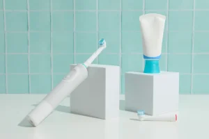 An electric toothbrush in a bathroom