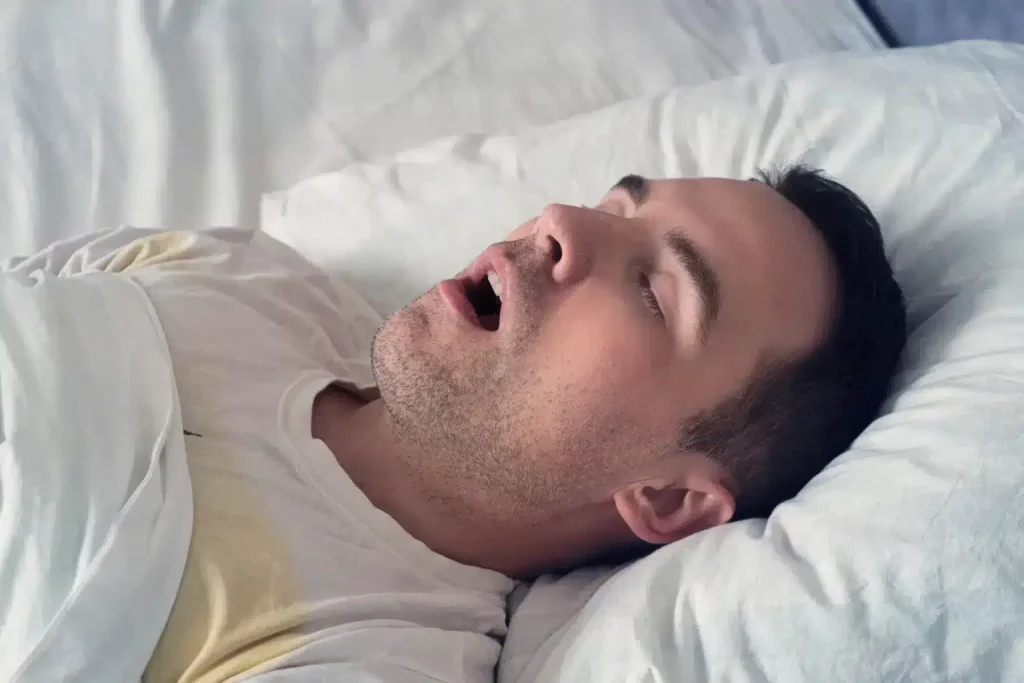 A man snoring while asleep